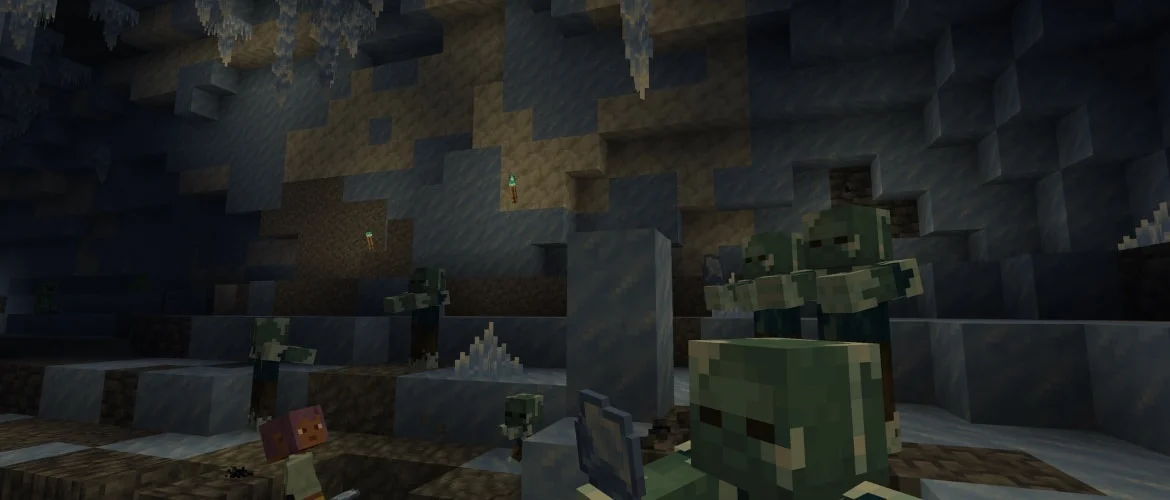 A Minecraft ice cave with icicles, ice crystals and a group of frostbites